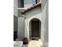 A close up of the covered front door and entrance of the townhome at 5930 Tivoli Gardens Blvd, Orlando, FL 32829