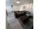 Bright living room with modern flooring, comfortable seating, and stylish decor at 615 Terra Lago St, Davenport, FL 33897