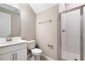 Clean bathroom with glass shower, modern fixtures, and white vanity at 645 Summit River Dr, Apopka, FL 32712