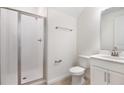 Clean bathroom featuring a glass-enclosed shower, modern vanity, and neutral decor for a fresh look at 655 Summit River Dr, Apopka, FL 32712