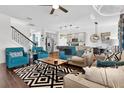 Spacious living room showcasing seamless flow to the kitchen and dining, perfect for entertaining at 1856 Castleton Dr, St Cloud, FL 34771
