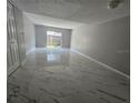 Bright living room with tile floors and sliding glass doors to the outdoor area at 1920 Conway Rd # 4, Orlando, FL 32812