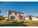 Spacious backyard with green grass and a shed, perfect for outdoor activities and relaxation at 2703 Eagle Canyon S Dr, Kissimmee, FL 34746