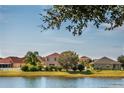 Scenic view of the neighborhood pond, offering a tranquil and picturesque setting for residents at 2703 Eagle Canyon S Dr, Kissimmee, FL 34746