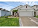 Home with a well-manicured lawn and attractive landscaping at 2838 Common Crane Ct, Harmony, FL 34773