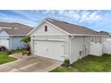View of the exterior of the attached two-car garage at 2838 Common Crane Ct, Harmony, FL 34773
