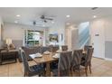Inviting living and dining area with neutral decor, ceiling fans, and sliding door access to the backyard at 331 Pendant Ct, Kissimmee, FL 34747