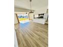 Bright living room with laminate flooring and sliding glass doors leading to the outside at 658 Caribbean Dr, Davenport, FL 33897