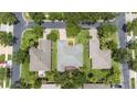 Aerial view of a home showcasing the roof, landscaping, and proximity to nearby streets and houses at 759 Largo Pass, Poinciana, FL 34759