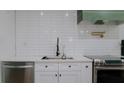 A beautifully designed kitchen with stainless steel appliances and subway tile backsplash at 9345 Atlanta Dr, St Cloud, FL 34773