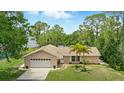 Charming single-story home featuring a well-maintained lawn and attached two car garage at 1186 Laguna Cir, St Cloud, FL 34771