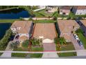 Beautiful aerial view of home with spacious backyard, lake view, and mature landscaping at 2736 Atherton Dr, Orlando, FL 32824
