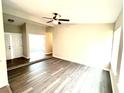 Bright living room featuring updated flooring, neutral paint, and lots of space for furniture at 3 Trophy Ln, Kissimmee, FL 34759
