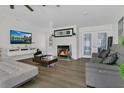 Bright living room with modern fireplace, comfortable seating, and contemporary decor at 3173 Wake Up Ct, Kissimmee, FL 34744
