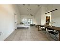 Open concept living room featuring high ceilings, neutral paint, and a sliding glass door to the backyard at 3901 Ballinore Pl, Gotha, FL 34734