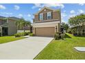 Charming two-story home with well-manicured landscaping, and double car garage with long driveway at 3991 Island Lakes Dr, Winter Haven, FL 33881