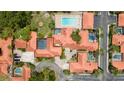 Beautiful aerial view showcases terracotta roofs, private pools, and lush landscaping in this community at 5015 Nassau Cir # 4, Orlando, FL 32808
