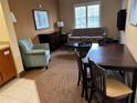 Comfortable living area features a sofa, table, and chairs, offering a relaxing space at 7601 Canada Ave, Orlando, FL 32819