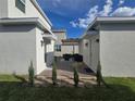 Outdoor patio featuring stylish furniture and a cozy pergola for relaxation at 11328 Listening Dr, Orlando, FL 32832