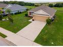 Well-maintained home with a long driveway and a two-car garage in a quiet neighborhood at 1158 Legatto Loop, Dundee, FL 33838