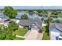 Aerial view of well-maintained home showing a scenic lake view at 121 White Birch Dr, Kissimmee, FL 34743