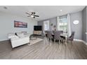 Inviting living area with dining area boasting stylish furnishings and ample natural light at 1335 Greenfield Loop, Kissimmee, FL 34747