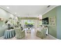 Comfortable living room with tile flooring, a ceiling fan, and access to the lanai at 201 Largo Dr, Kissimmee, FL 34759