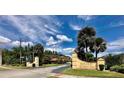 Community entrance sign that reads 'Royale Bermuda' with tropical foliage around the area at 2031 Balboa Way, Kissimmee, FL 34741