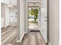 Inviting foyer showcases modern flooring and a welcoming entrance into the home at 2146 Fish Eagle St, Clermont, FL 34714