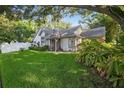 Charming single-story home featuring a well-manicured lawn and tasteful landscaping at 2225 Maryday Ct, Orlando, FL 32812
