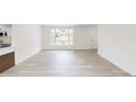 Open-concept living room with an abundance of natural light and seamless flow at 3621 Devonswood Dr, Orlando, FL 32806