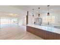 Open-concept living area leads to the gourmet kitchen with an island and stainless steel appliances at 3621 Devonswood Dr, Orlando, FL 32806