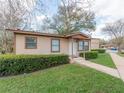 Side view of a well-maintained single-story home with neat landscaping and a cozy appearance at 405 Eron Way # 39, Winter Garden, FL 34787