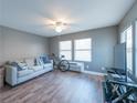 Spacious living room with neutral decor, hardwood floors, and abundant natural light at 405 Eron Way # 39, Winter Garden, FL 34787
