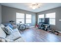 Comfortable living room with hardwood floors, modern gray paint and lots of natural light at 405 Eron Way # 39, Winter Garden, FL 34787