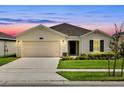 Charming one-story home with a well-manicured lawn and two car garage, perfect for suburban living at 4492 Bluff Oak Loop, Kissimmee, FL 34746