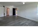 Open-concept living room featuring modern flooring and a bright, airy atmosphere at 793 N Kentucky Ave, Umatilla, FL 32784