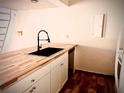 Well-appointed kitchen featuring modern countertops, white cabinetry, and a stylish faucet at 806 Pinewood Ct # 3135/6, Haines City, FL 33844