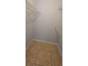 Walk-in closet with tile flooring and wire shelving provides organized storage space at 1023 S Hiawassee Rd # 4017, Orlando, FL 32835