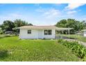 View of home featuring a well-maintained yard and simple design at 120 & 0 8Th Wahneta W St, Winter Haven, FL 33880