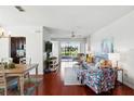 Bright living room boasts hardwood floors, slider to deck, comfortable seating, and stylish decor at 1225 Bella Cara Ct # 1, Davenport, FL 33896
