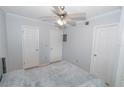 Cozy bedroom with soft carpet, ceiling fan, and ample closet space for storage at 139 Oyster Bay Cir # 200, Altamonte Springs, FL 32701