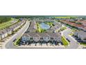 A peaceful townhome community complete with a serene pond and lush greenery throughout at 4850 Coral Castle Dr, Kissimmee, FL 34746