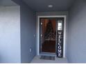 Inviting front entryway with a welcome sign, creating a warm and friendly entrance at 621 Vittorio Dr, Winter Haven, FL 33884