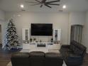 Stylish living room with modern entertainment center, comfortable seating, and lots of space at 621 Vittorio Dr, Winter Haven, FL 33884