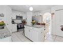 Kitchen with granite counters, center island, and stainless appliances at 1526 Ferendina Dr, Deltona, FL 32725