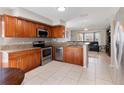 Well-equipped kitchen featuring stainless steel appliances and granite countertops at 108 Honeywood Ct, Kissimmee, FL 34743