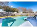 Sparkling pool featuring clear water, surrounded by a well-maintained patio and an established lawn at 1375 Springfield St, Kissimmee, FL 34744