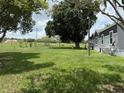 Manufactured home on a large lot with mature landscaping at 15311 Johns Lake Rd, Clermont, FL 34711