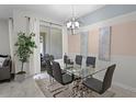 Dining room showcasing a modern table, chairs, lighting fixture, and decor at 1565 Plunker Dr, Davenport, FL 33896
